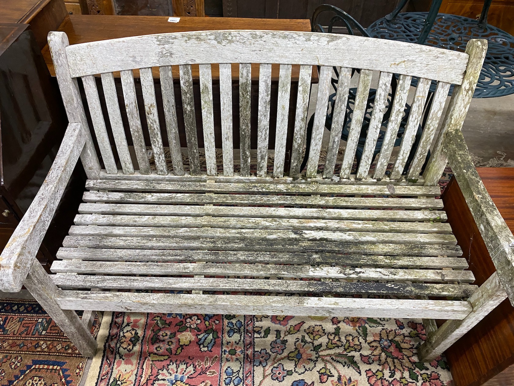 A weathered teak garden bench, width 120cm